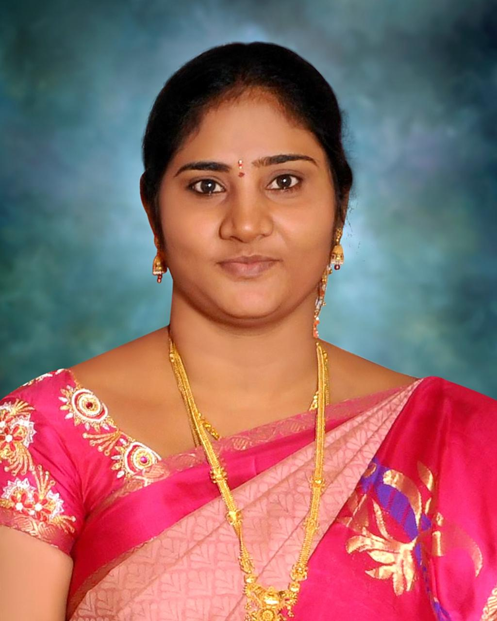 A customer styled in a pink festive saree